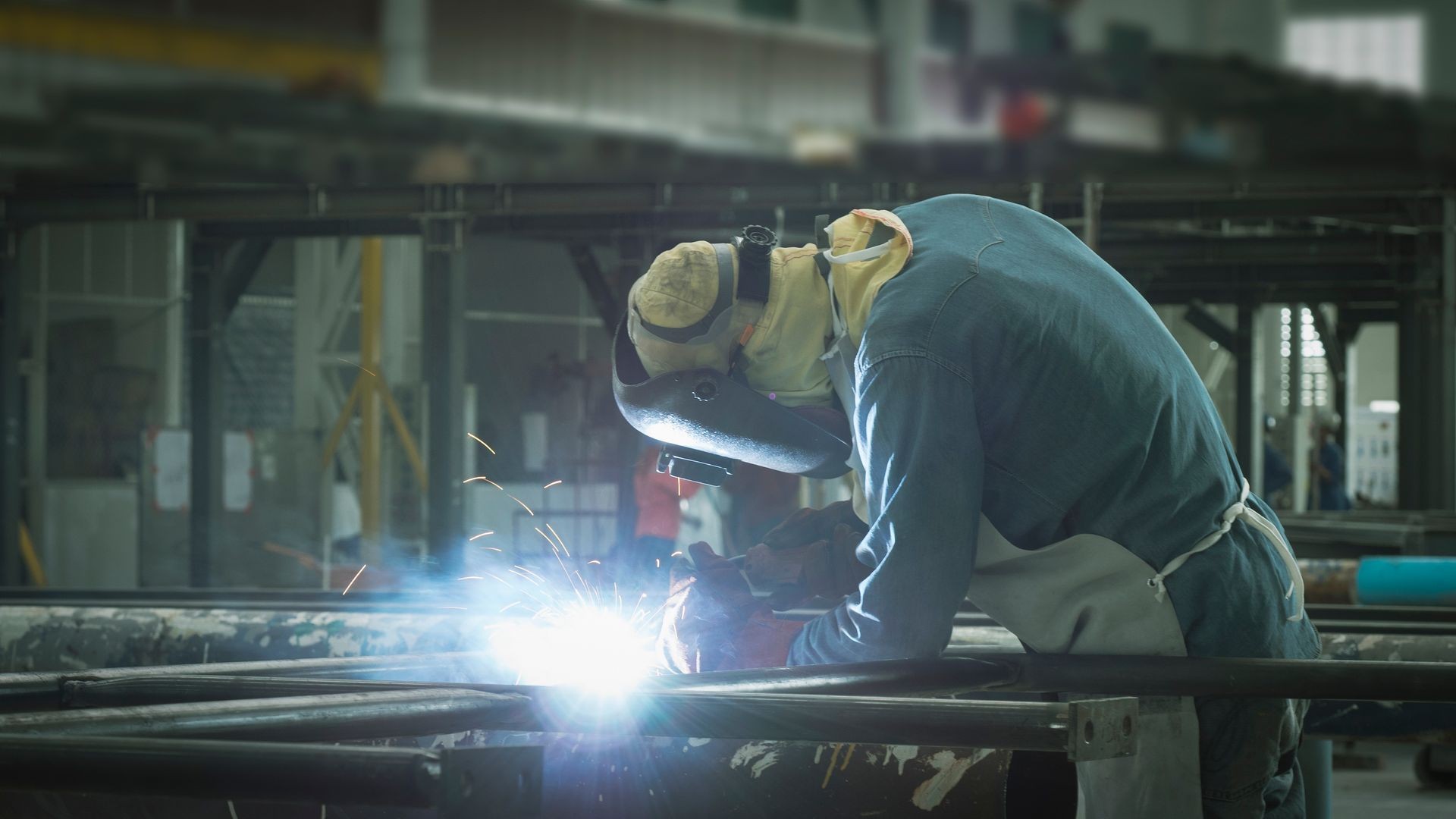 Welder is welding flux cored arc welding ,Industrial welding part in Oil and Gas or Petrochemical,Copy space Welder is welding flux cored arc welding ,Industrial welding part in Oil and Gas or Petrochemical,Copy space